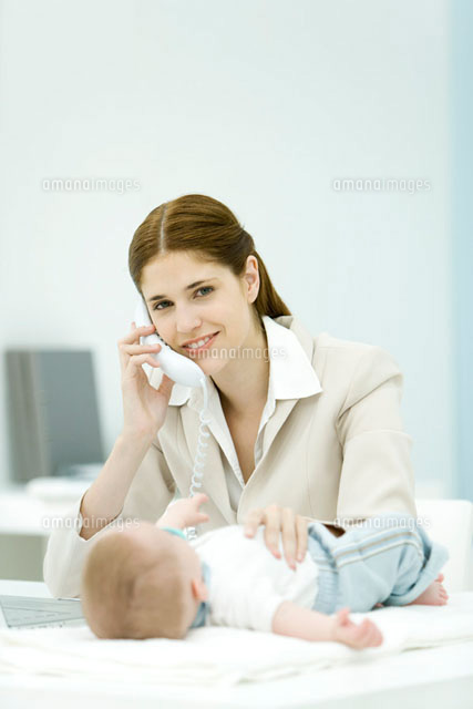 Professional woman using phone in office
(c)Alix Minde/PhotoAlto