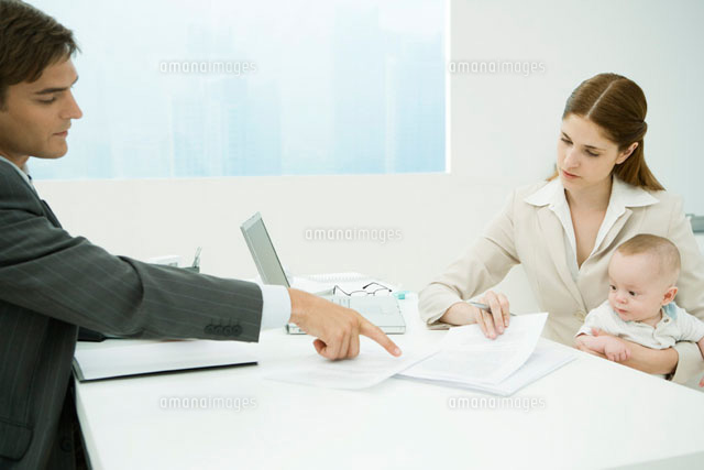 Professional woman in office, holding baby on lap
(c)Alix Minde/PhotoAlto