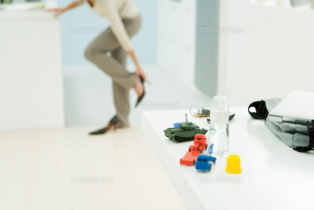 Professional woman getting dressed
(c)Alix Minde/PhotoAlto