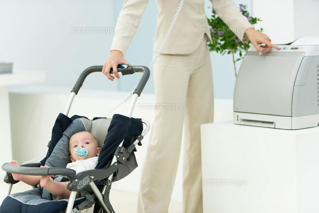 Professional woman in office with baby in stroller
(c)Alix Minde/PhotoAlto