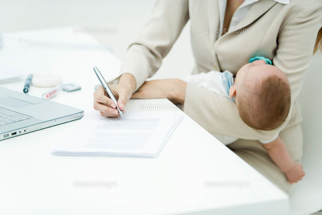 Professional woman signing document at desk
(c)Alix Minde/PhotoAlto