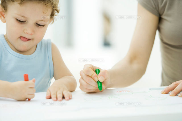 Mother and son coloring with crayons together
(c)Alix Minde/PhotoAlto