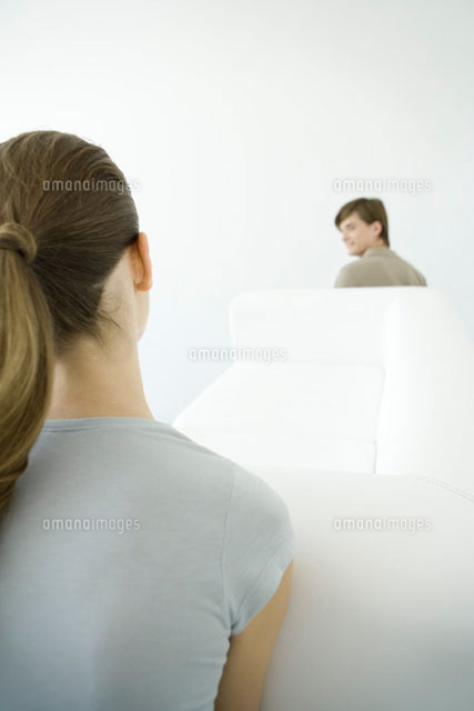 Couple moving sofa together, over the shoulder view
(c)Alix Minde/PhotoAlto