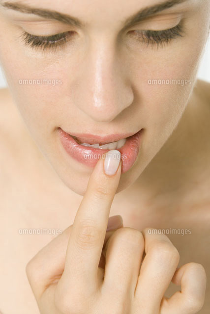 Woman holding finger to lip,close-up of face
(c)Alix Minde/PhotoAlto