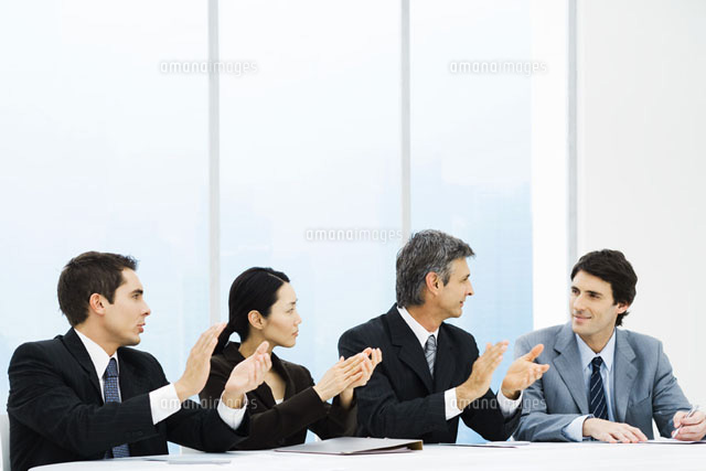 Executives applauding male colleague during meeting
(c)Frederic Cirou/PhotoAlto