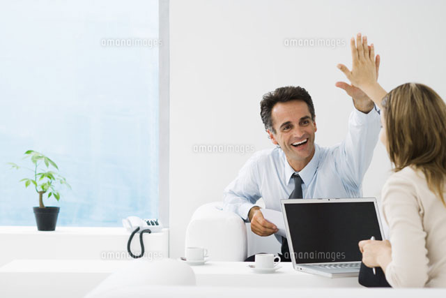 Business associates giving each other high-five in office
(c)Frederic Cirou/PhotoAlto