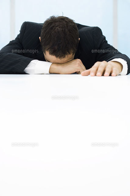 Businessman with head down on table
(c)Frederic Cirou/PhotoAlto