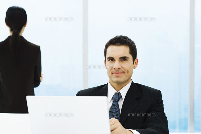 Businessman sitting behind computer screen
(c)Frederic Cirou/PhotoAlto