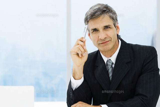 Businessman holding pen up to head,portrait
(c)Frederic Cirou/PhotoAlto