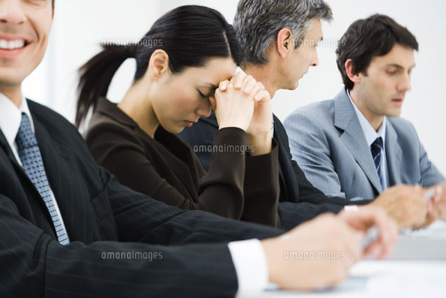 Executives in business meeting,woman closing eyes
(c)Frederic Cirou/PhotoAlto