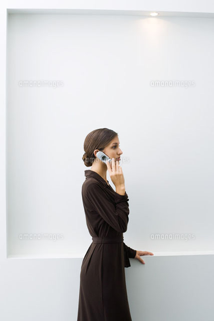 Well-dressed young female using cell phone,standing
(c)Frederic Cirou/PhotoAlto