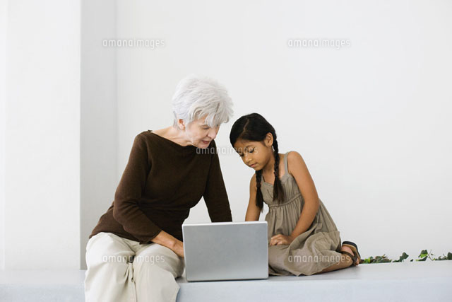 Senior woman and granddaughter using laptop together
(c)Frederic Cirou/PhotoAlto