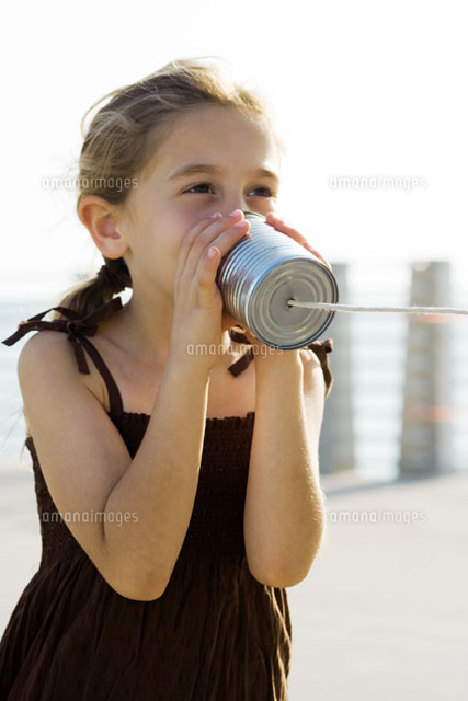 Girl talking into tin can phone
(c)Frederic Cirou/PhotoAlto