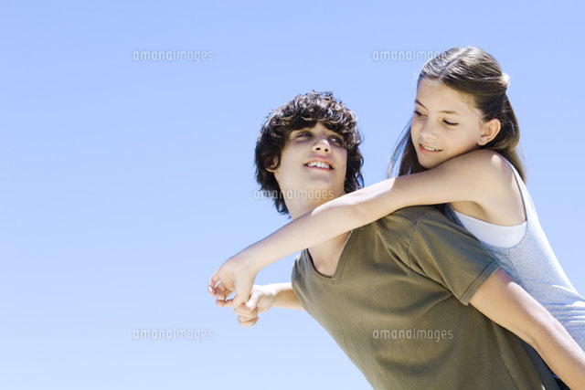 Boy carrying sister on his back,both smiling at each other
(c)Michele Constantini/PhotoAlto
