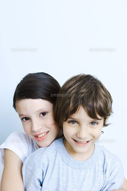 Sister hugging her brother from behind
(c)Michele Constantini/PhotoAlto