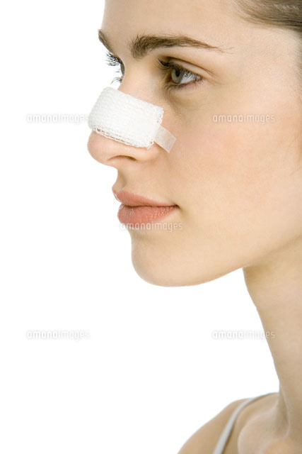 Young woman with bandaged nose,profile,cropped
(c)Alix Minde/PhotoAlto