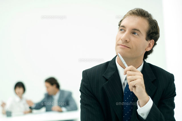 Businessman holding pen against chin,looking up in thought
(c)Eric Audras/PhotoAlto