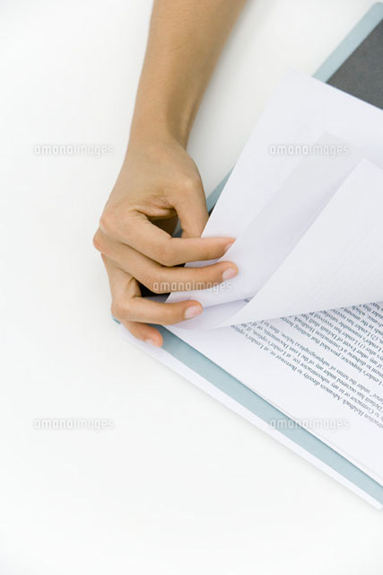 Hand turning document pages,close-up
(c)Alix Minde/PhotoAlto