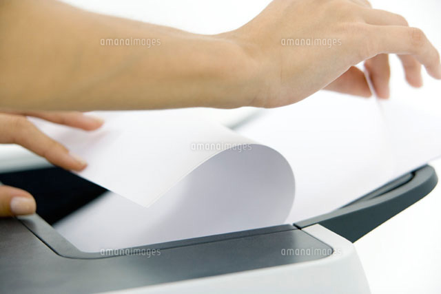 Hands arranging paper in printer,cropped
(c)Alix Minde/PhotoAlto