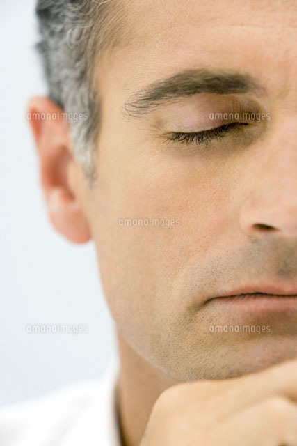 Man with eyes closed,hand under chin,cropped view
(c)Alix Minde/PhotoAlto
