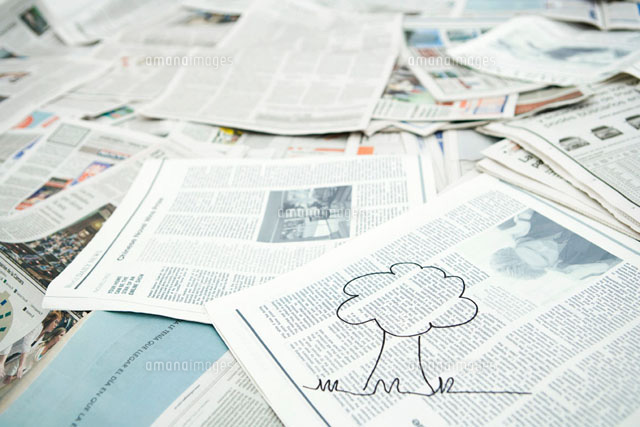 Drawing of tree on pile of newspaper
(c)Sigrid Olsson/PhotoAlto