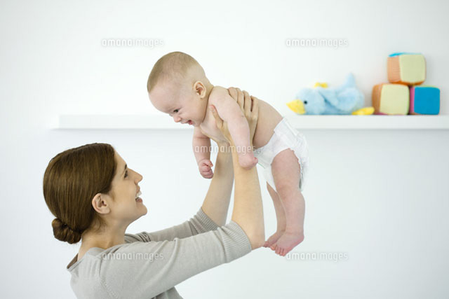 Mother lifting baby in the air,both smiling at each other
(c)Ale Ventura/PhotoAlto