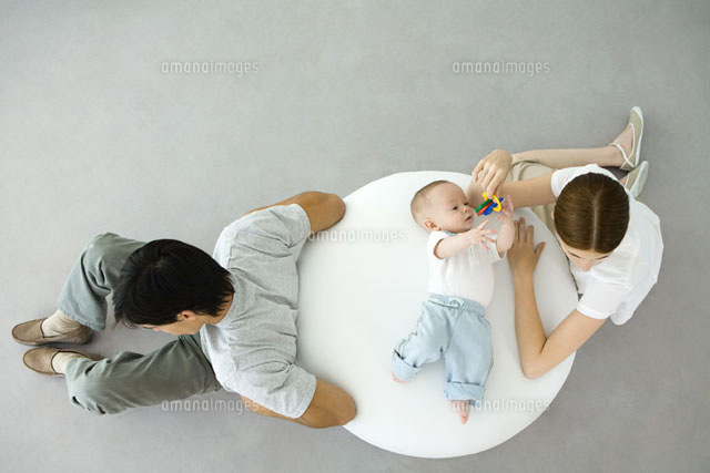 Mother playing with infant lying on ottoman
(c)Ale Ventura/PhotoAlto