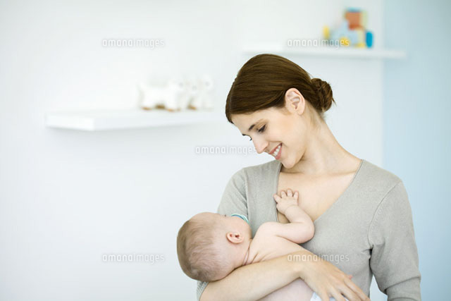 Mother in nursery,smiling down at baby in her arms
(c)Ale Ventura/PhotoAlto