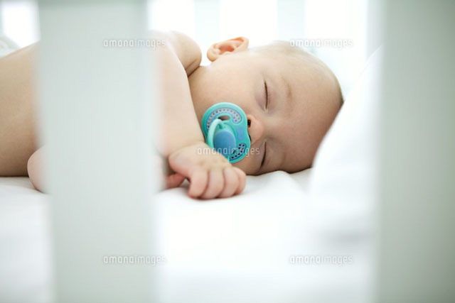 Baby sleeping in crib,pacifier in mouth
(c)Ale Ventura/PhotoAlto