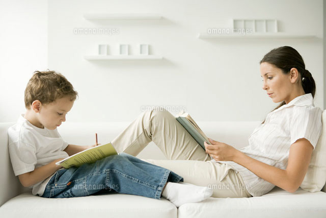 Mother and son sitting face to face on sofa
(c)Sigrid Olsson/PhotoAlto