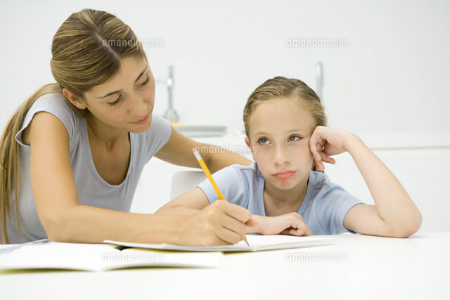 Mother helping daughter with homework
(c)Sigrid Olsson/PhotoAlto