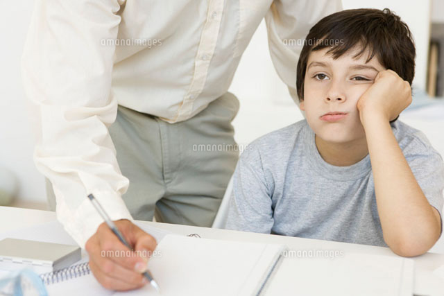 Father helping son with homework,boy holding head
(c)Sigrid Olsson/PhotoAlto