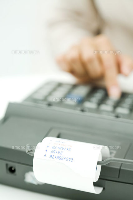 Person using adding machine,cropped view
(c)Ale Ventura/PhotoAlto