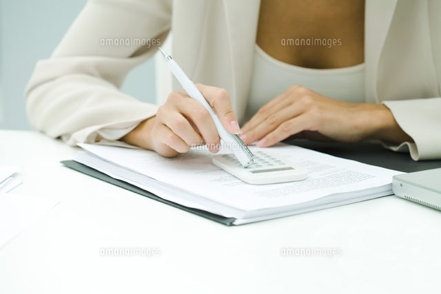 Professional woman using calculator,cropped view
(c)Ale Ventura/PhotoAlto