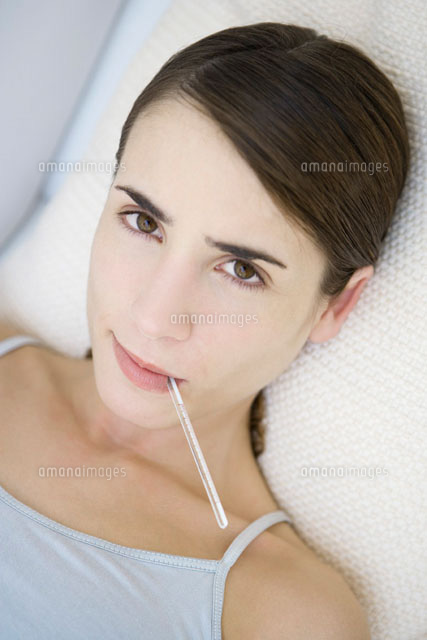 Woman with thermometer in her mouth,close-up
(c)Alix Minde/PhotoAlto