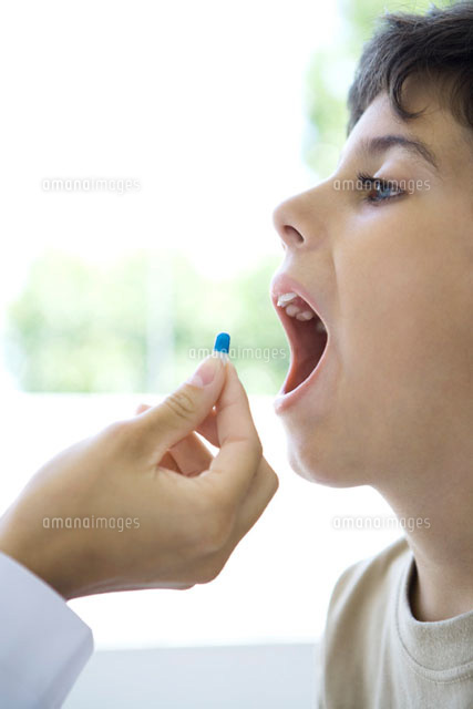 Child accepting pill with open mouth,cropped view
(c)Alix Minde/PhotoAlto