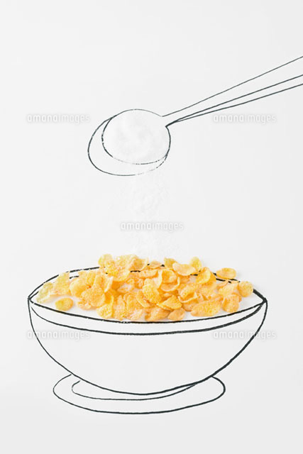 Spoon sprinkling sugar on bowl of cereal
(c)Laurence Mouton/PhotoAlto