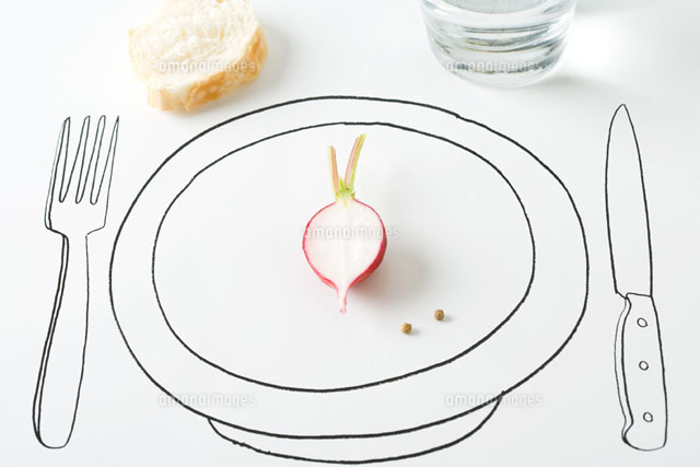 Half a radish and two peppercorns on plate,bread nearby
(c)Laurence Mouton/PhotoAlto