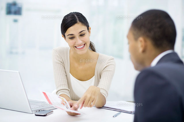 Professional woman reviewing brochure with customer
(c)Eric Audras/PhotoAlto