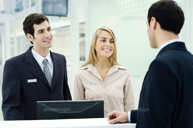 Customer service representatives smiling at businessman
(c)Eric Audras/PhotoAlto