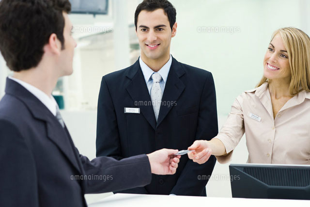 Man giving credit card to customer service representatives
(c)Eric Audras/PhotoAlto