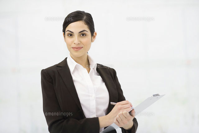 Businesswoman holding clipboard,taking notes
(c)Eric Audras/PhotoAlto