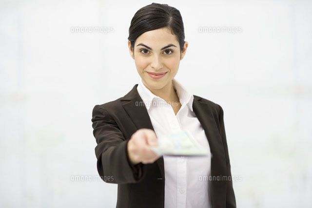Woman holding out document,smiling at camera
(c)Eric Audras/PhotoAlto