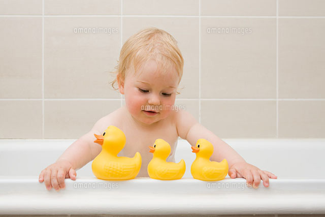 A baby looking at a row of rubber ducks
(c)Image Source