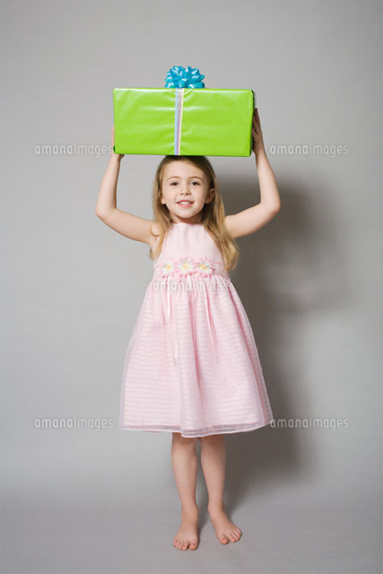 Girl holding a birthday gift
(c)Image Source