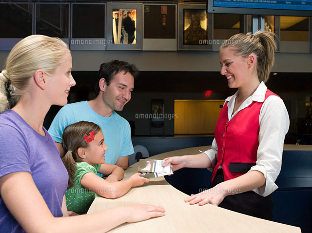 A family buying tickets from the box office
(c)Image Source
