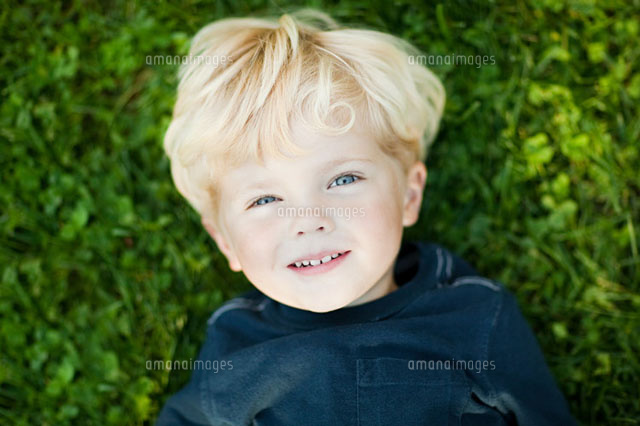 Boy lying on grass
(c)Image Source