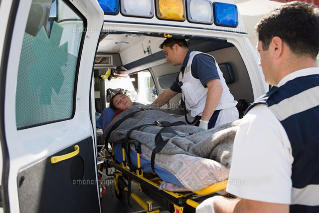 Ambulance staff and patient on stretcher
(c)Image Source
