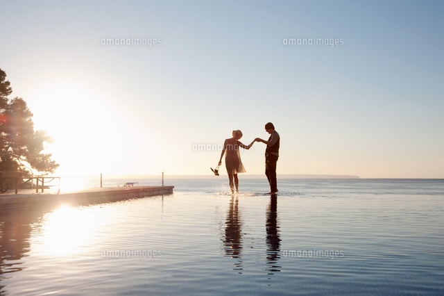 Couple in the ocean at sunset
(c)Image Source