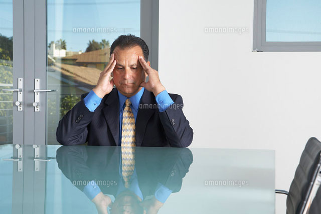 Businessman in Boardroom
(c)Radius Images